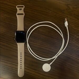 Series 3 Apple Watch with Beige Band and Charger. 42mm